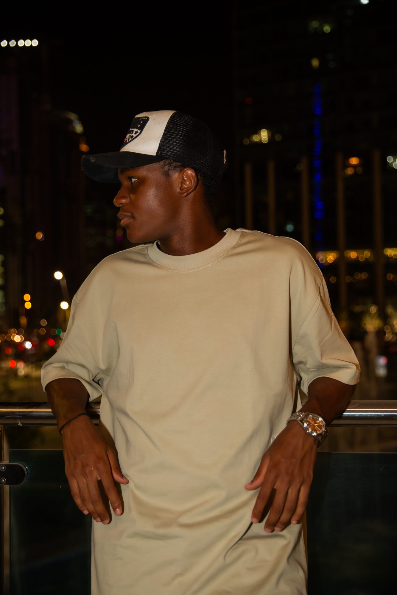 Model in a sand tee at night