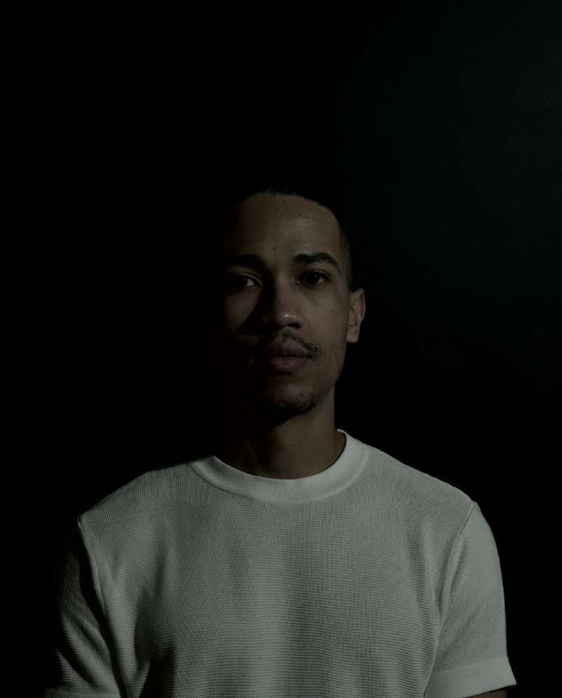 Portrait of Khadil Wayde in a white t-shirt